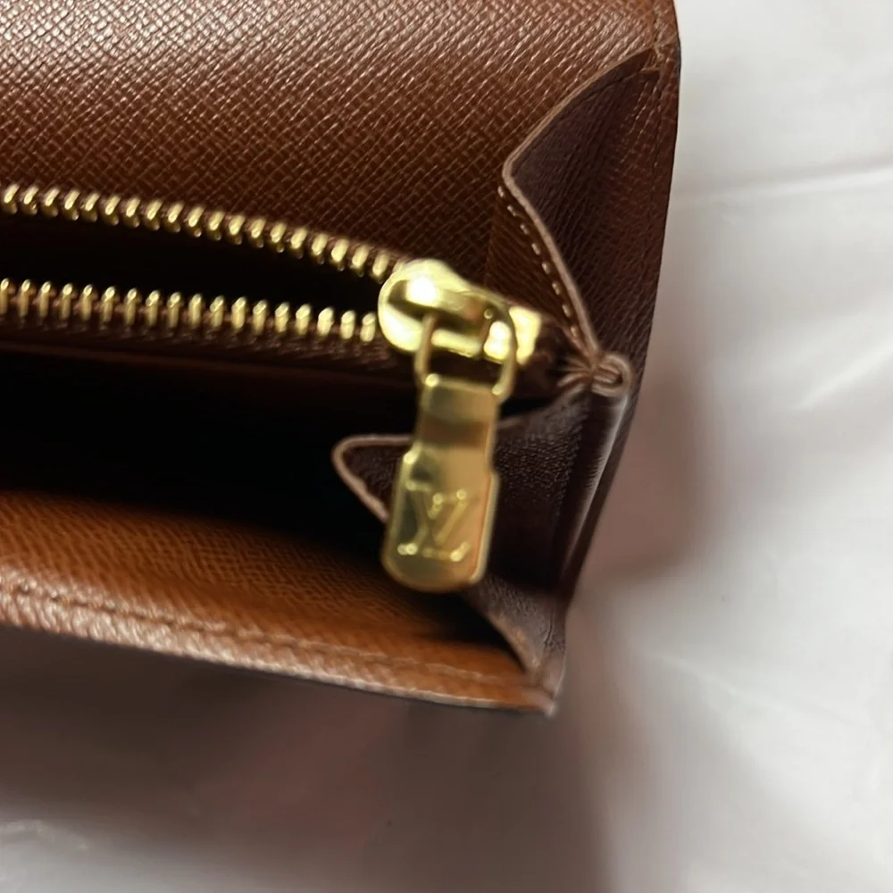 Louis Vuitton monogram sara long wallet.